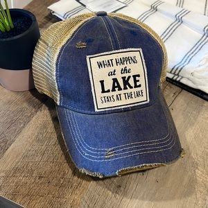 What happens at the lake stays at the lake distressed trucker hat